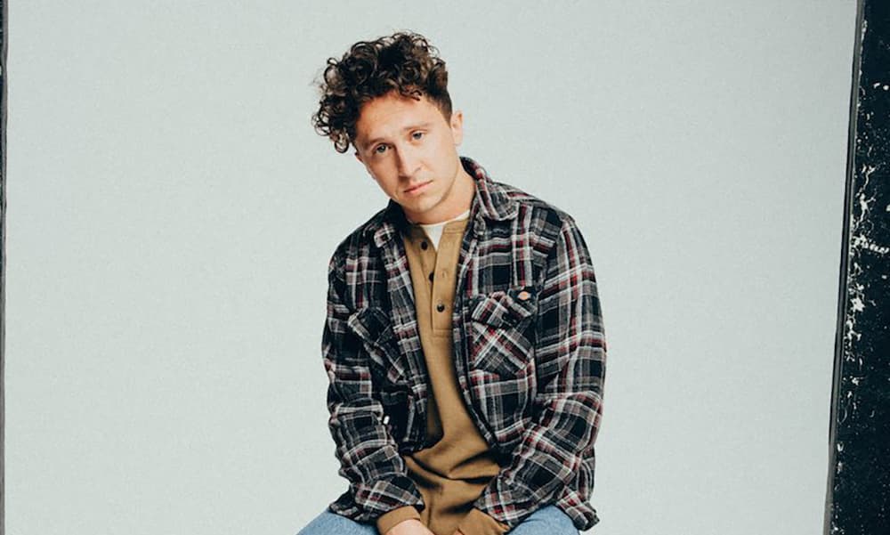 Joel Baker Teases Debut LP With "What's A Song" Video